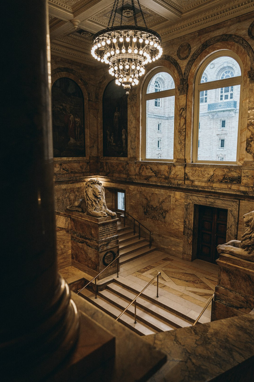 Grand historic library with rows of shelves and reading tables